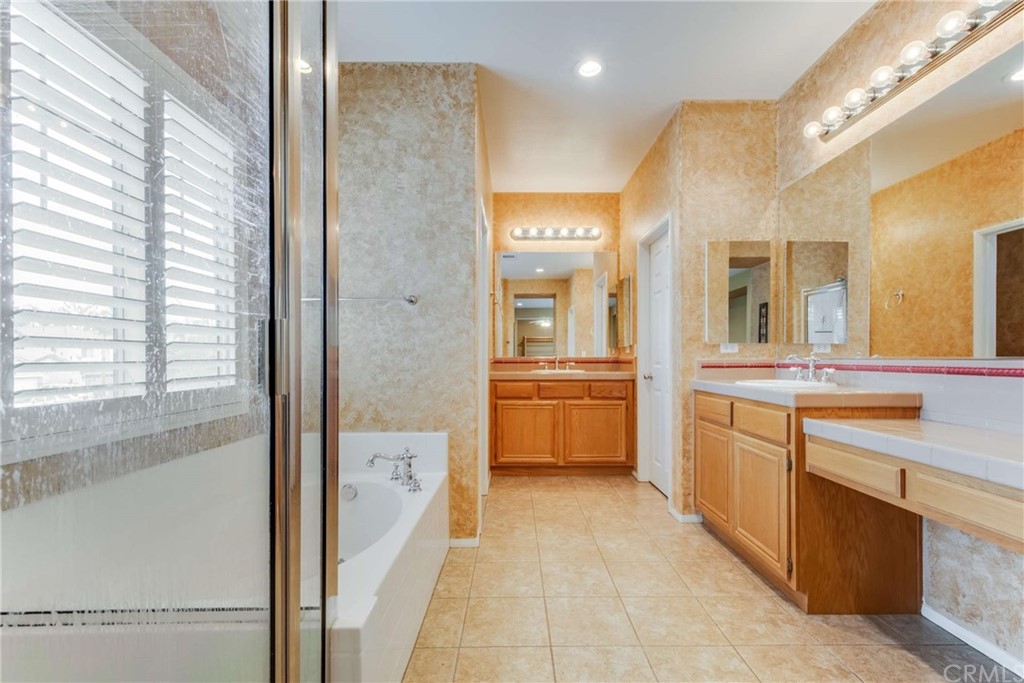 23537 Cantara Road Corona, CA 92883 - Photo 43 of 60 a large bathroom with a large tub and sink