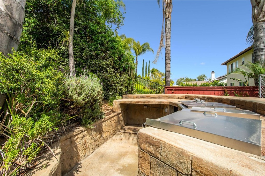23537 Cantara Road Corona, CA 92883 - Photo 57 of 60 a view of a swimming pool with outdoor seating and plants