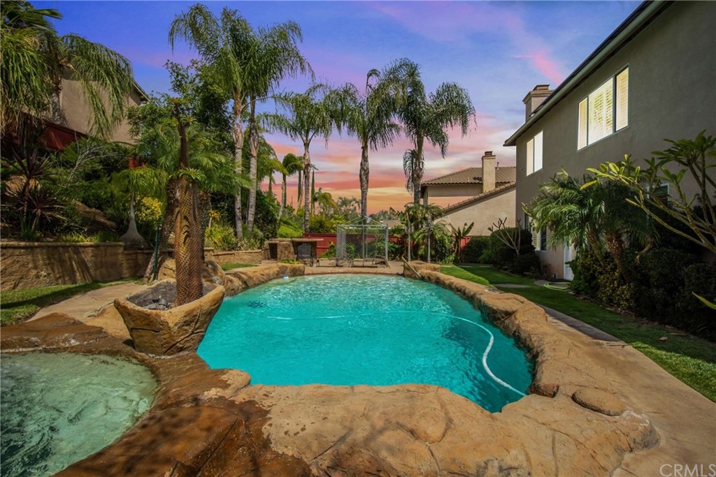 23537 Cantara Road Corona, CA 92883 - Photo 58 of 60 a view of a swimming pool with a garden