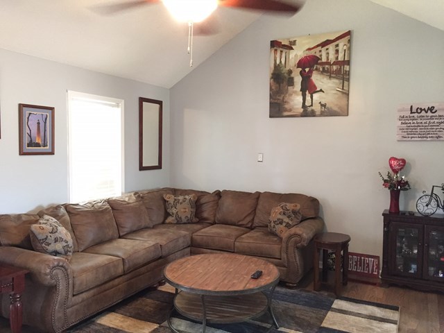 513 Music Row, Unit 9 Forsyth, GA 31029 - Photo 2 of 19 a living room with furniture a couch and a wall painting