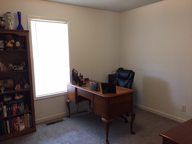 513 Music Row, Unit 9 Forsyth, GA 31029 - Photo 14 of 19 a room with furniture and book shelf