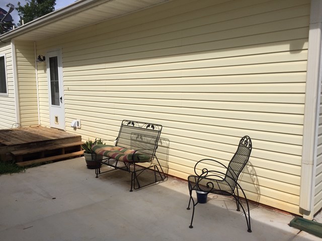 513 Music Row, Unit 9 Forsyth, GA 31029 - Photo 17 of 19 a backyard of a house with table and chairs