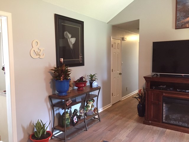 513 Music Row, Unit 9 Forsyth, GA 31029 - Photo 6 of 19 a living room with furniture and a flat screen tv