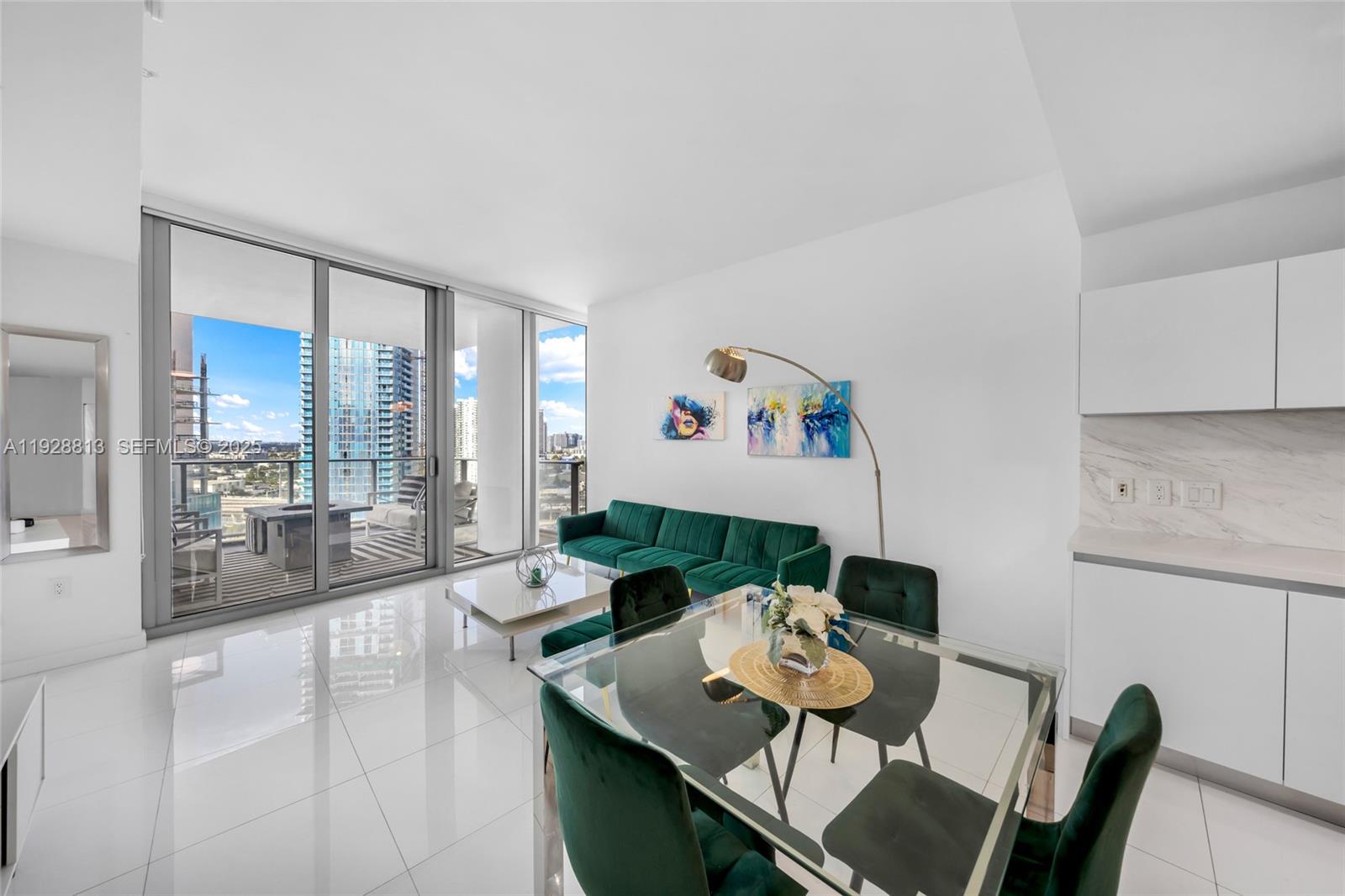 851 Northeast 1st Avenue, Unit 1700 Miami, FL 33132 - Photo 12 of 30 a living room with furniture and a table