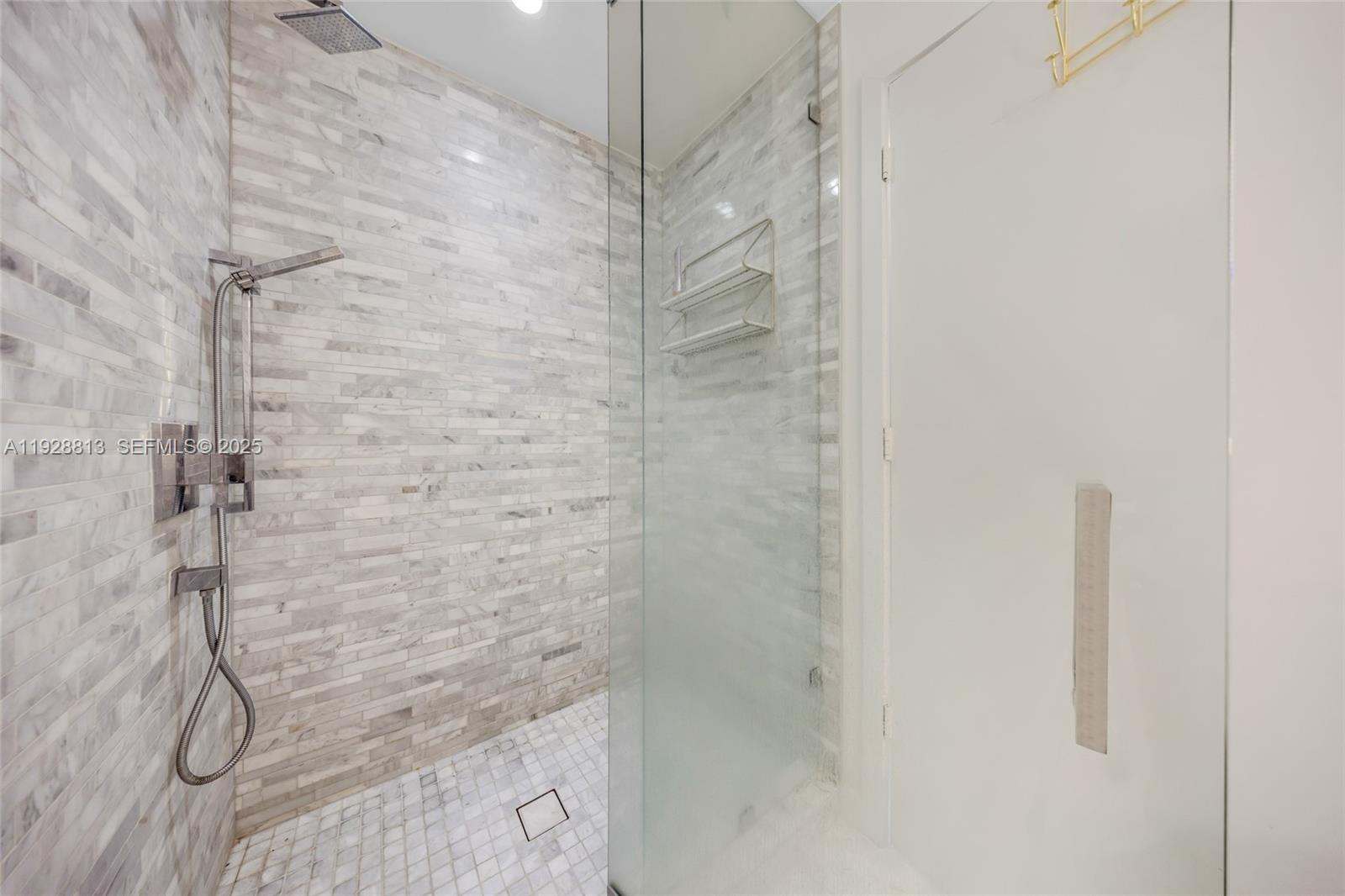 851 Northeast 1st Avenue, Unit 1700 Miami, FL 33132 - Photo 24 of 30 a bathroom with a shower