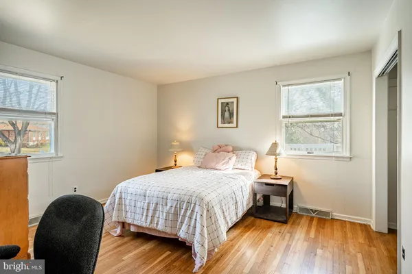 a bedroom with a workspace