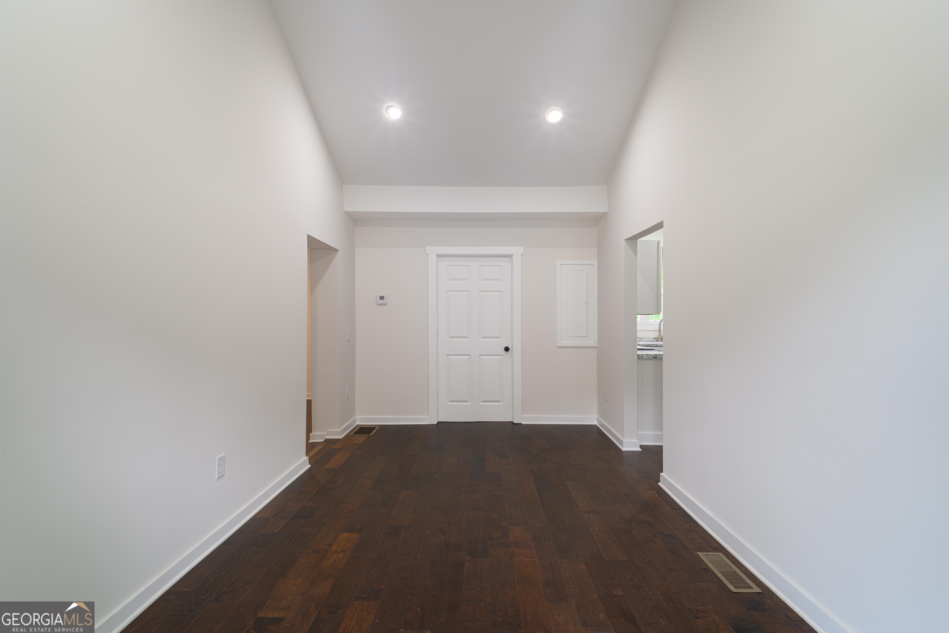 418 Lamb Road Moreland, GA 30259 - Photo 4 of 32 a view of a big room with wooden floor