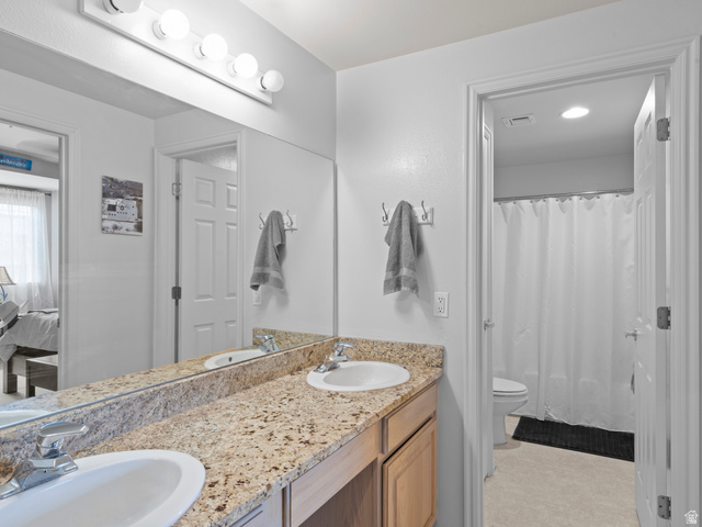 900 Bitner Road, Unit D 34 Park City, UT 84098 - Photo 18 of 25 Ensuite bathroom featuring double vanity and light flooring