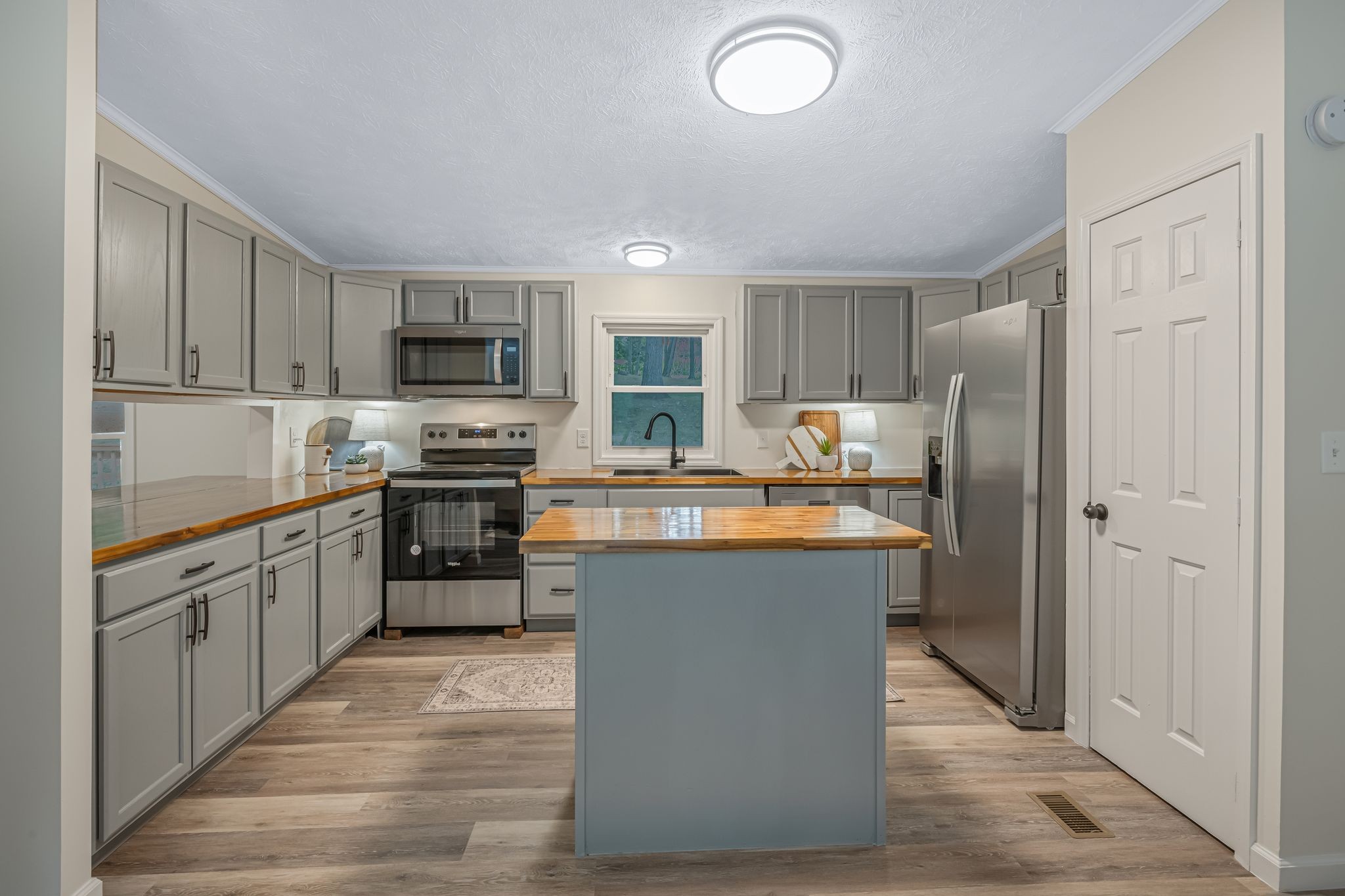840 Promise Land Road Charlotte, TN 37036 - Photo 13 of 38 Kitchen features a Large Pantry + Butcher Block Island