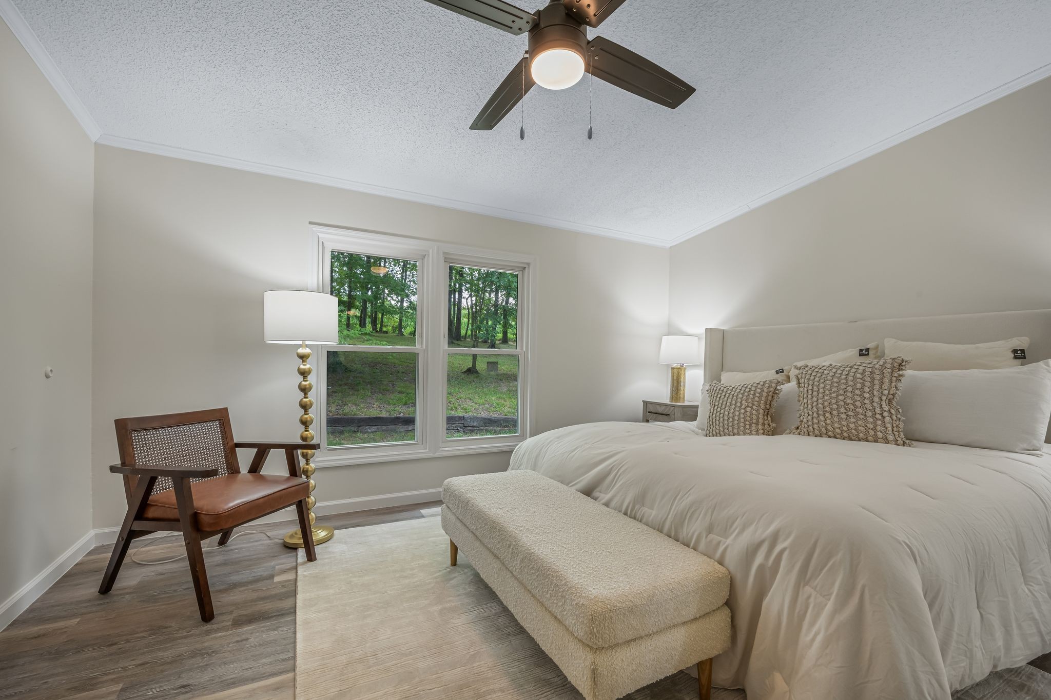 840 Promise Land Road Charlotte, TN 37036 - Photo 17 of 38 SPACIOUS + PRIVATE Primary Suite NEW Wide Plank Flooring + New Ceiling Fan
