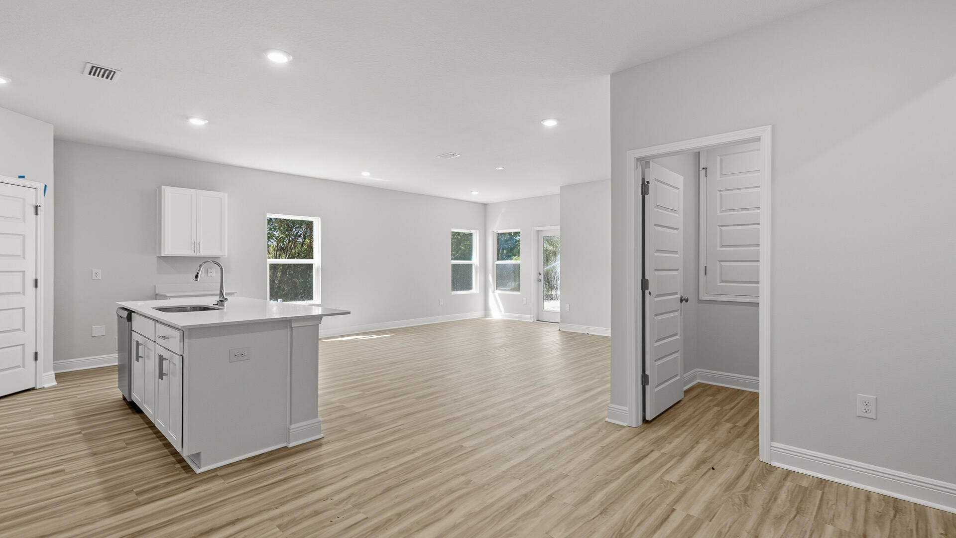 2075 Wiregrass Street Navarre, FL 32566 - Photo 6 of 29 a kitchen with a sink and wooden floor