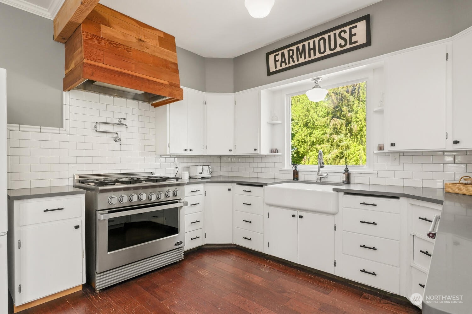 9120 Lowell Larimer Road Everett, WA 98208 - Photo 19 of 40 a kitchen with cabinets appliances a sink and a window