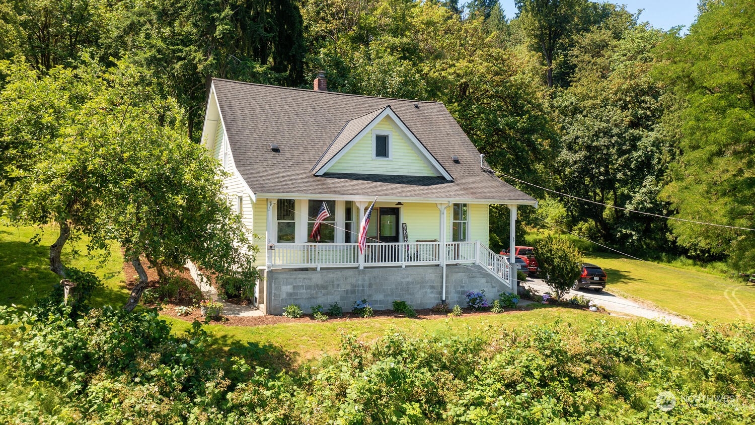9120 Lowell Larimer Road Everett, WA 98208 - Photo 6 of 40 a front view of house with yard and trees in the background