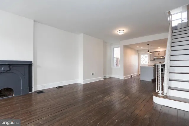 a view of a livingroom with wooden floor
