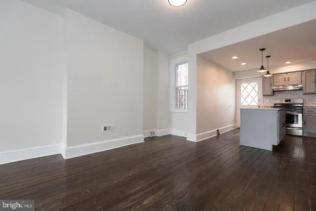 a view of kitchen with wooden floor and window