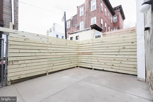 a view of a building with a parking space