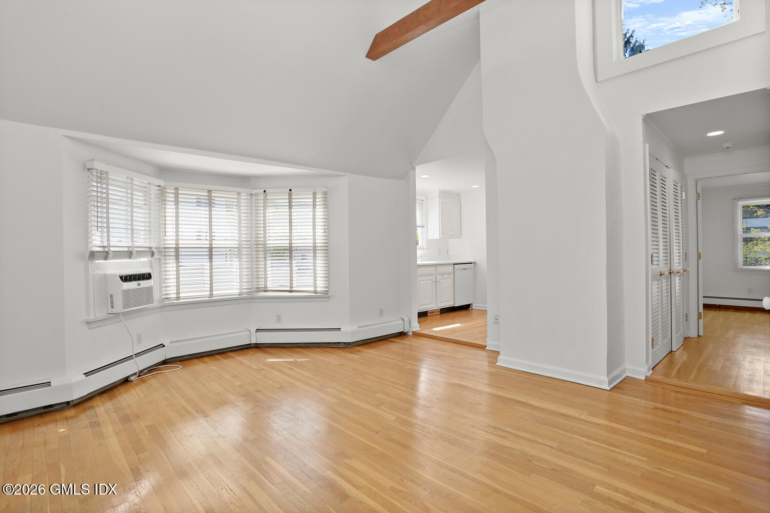22 Grigg Street, Unit 2 Greenwich, CT 06830 - Photo 4 of 11 a view of an empty room with window and wooden floor