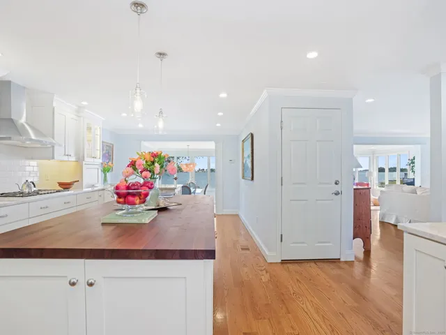 a view of kitchen with furniture and refrigerator