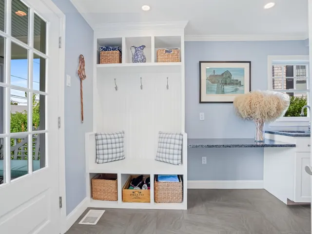 a kitchen with a sink and a washer dryer