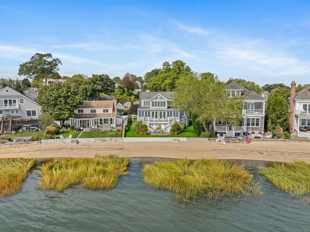 a view of a swimming pool with a table and chairs