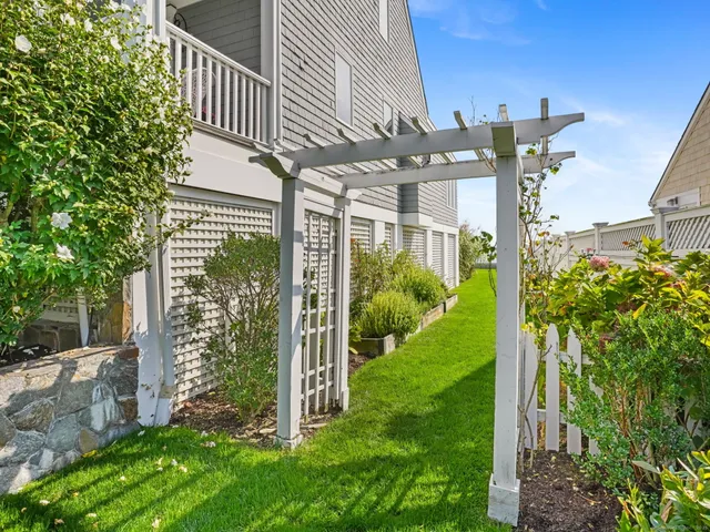 an aerial view of residential building with ocean view