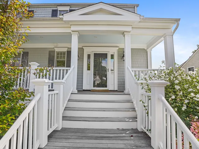 a view of a house with wooden floor and windows