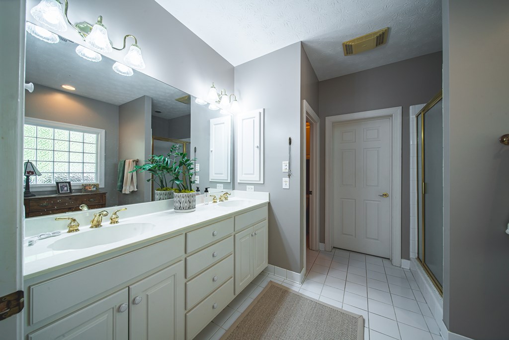 4607 Baltusrol Court Columbus, GA 31909 - Photo 14 of 35 a bathroom with a double vanity sink mirror and double