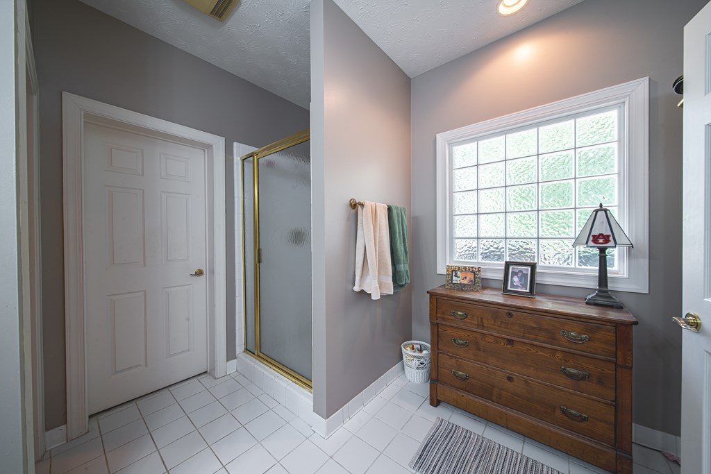 4607 Baltusrol Court Columbus, GA 31909 - Photo 15 of 35 a room with a dresser and a window