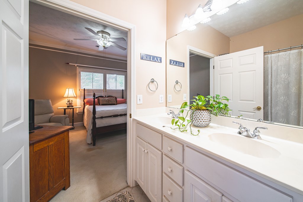4607 Baltusrol Court Columbus, GA 31909 - Photo 24 of 35 a en suite bathroom with a double vanity sink and a mirror