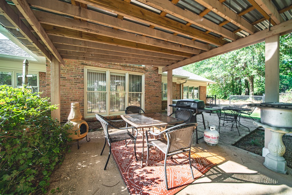 4607 Baltusrol Court Columbus, GA 31909 - Photo 29 of 35 a view of a patio with table and chairs and potted plants