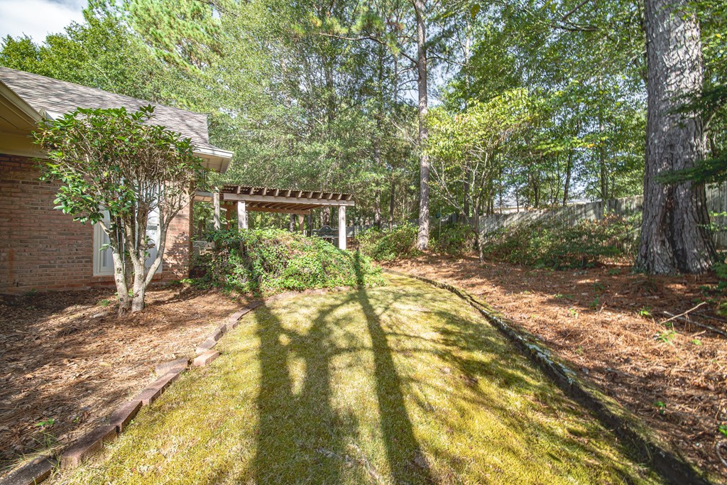 4607 Baltusrol Court Columbus, GA 31909 - Photo 30 of 35 a view of a yard with plants and trees