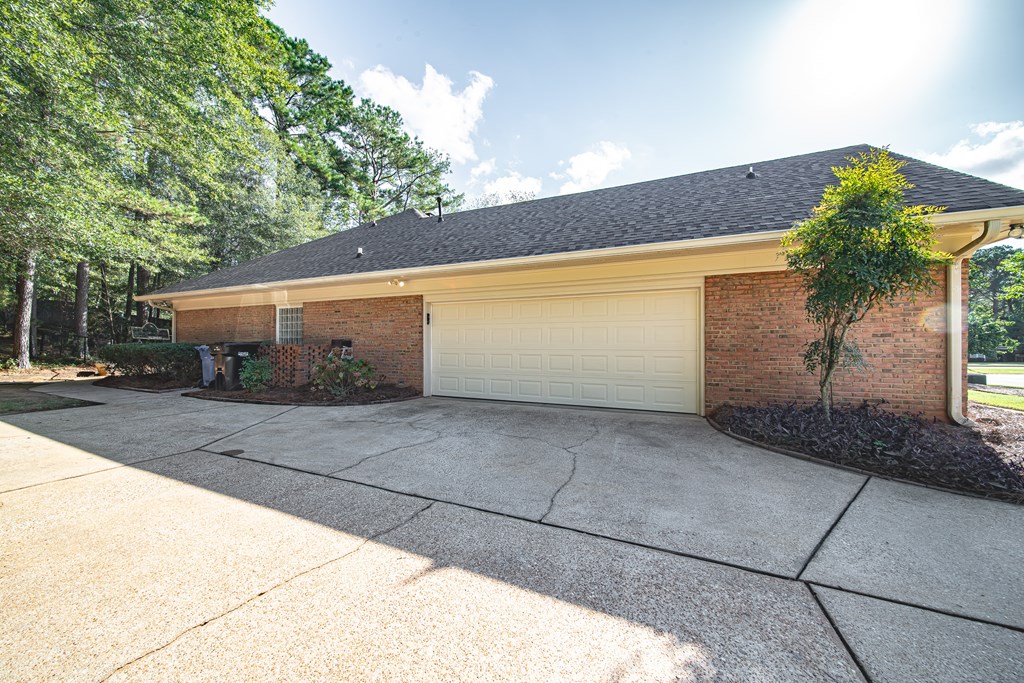 4607 Baltusrol Court Columbus, GA 31909 - Photo 32 of 35 a front view of a house with a yard and garage