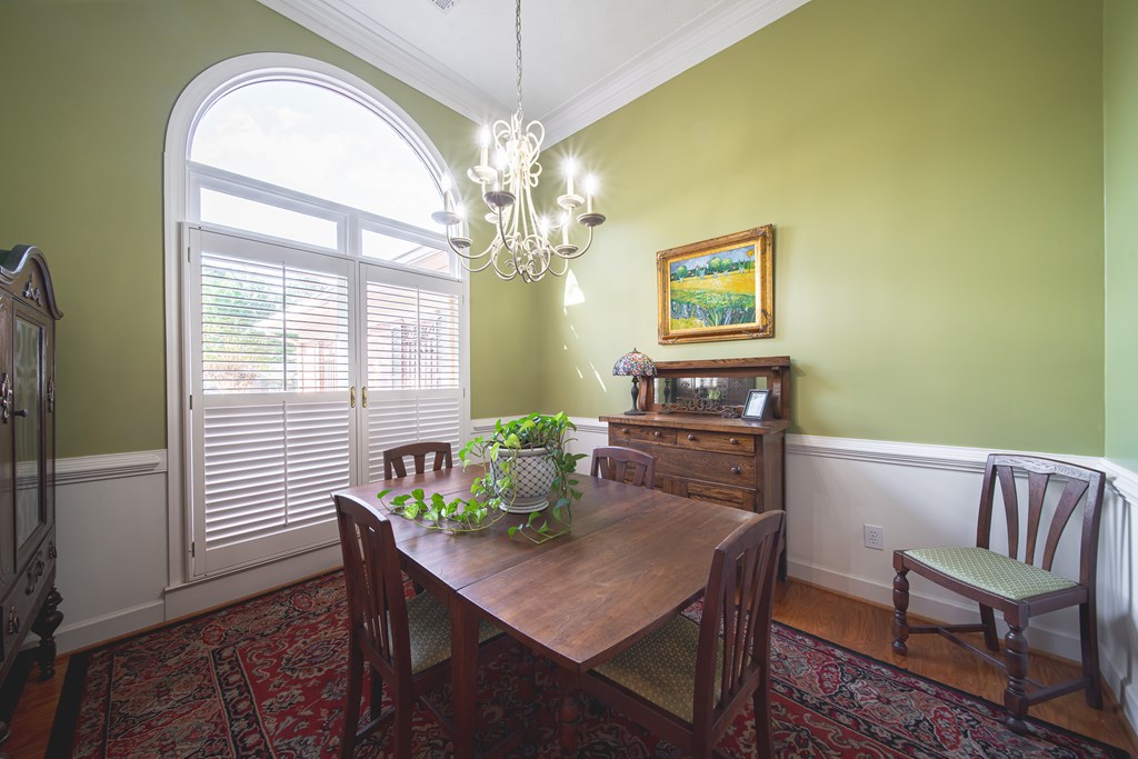 4607 Baltusrol Court Columbus, GA 31909 - Photo 5 of 35 a view of a dining room with furniture and a chandelier