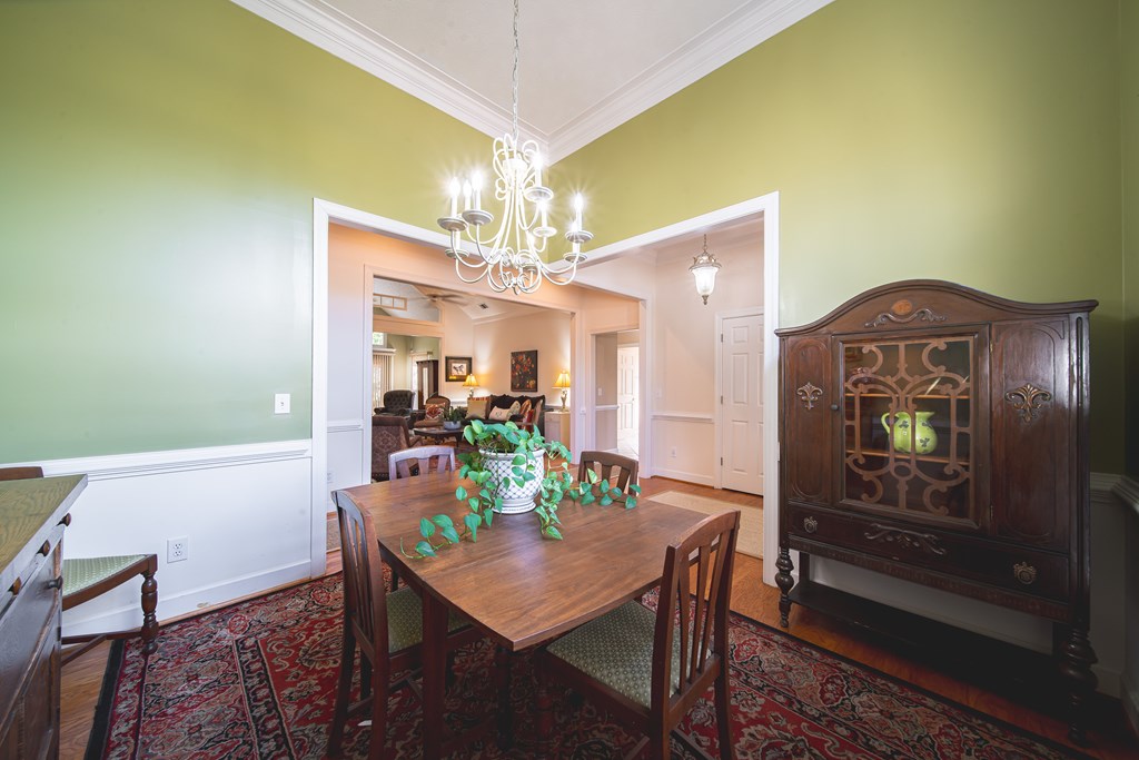 4607 Baltusrol Court Columbus, GA 31909 - Photo 6 of 35 a view of a dining room with furniture and chandelier