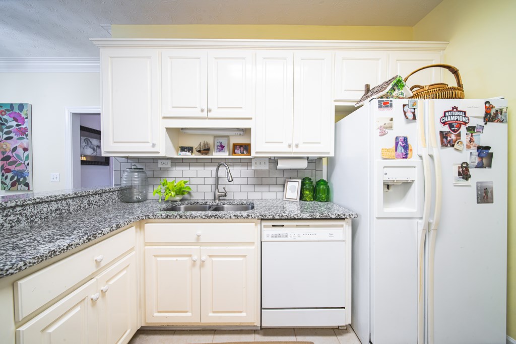 4607 Baltusrol Court Columbus, GA 31909 - Photo 9 of 35 a kitchen with appliances a sink and cabinets