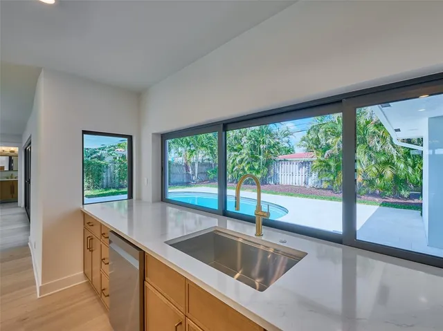 a view of room with window and ceiling fan