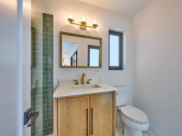 a view of a house with a garden and deck