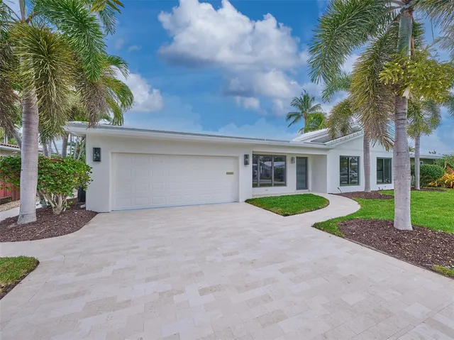 a view of a house with a yard and plants