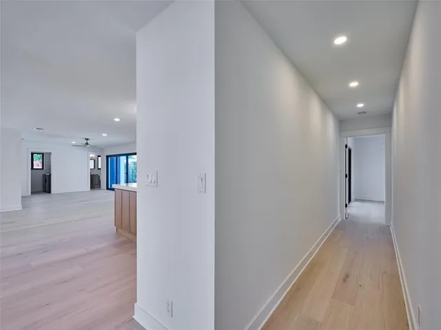 a view of a swimming pool with an outdoor seating and a potted plant