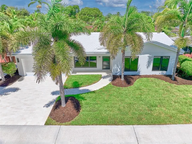 a view of kitchen and hall with wooden floor