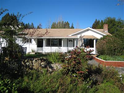 12995 Occidental Road Sebastopol, CA 95472 - Photo 1 of 12 Front view of home. The house was recently painted and the windows were replaced with dual pane energy efficient windows.