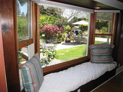 12995 Occidental Road Sebastopol, CA 95472 - Photo 6 of 12 Window seat in living room looks out on the front patio and fountain.
