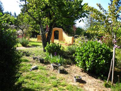 12995 Occidental Road Sebastopol, CA 95472 - Photo 10 of 12 Whimsical garden wall and gate.