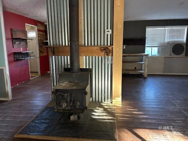 a view of a room with wooden floor and a window