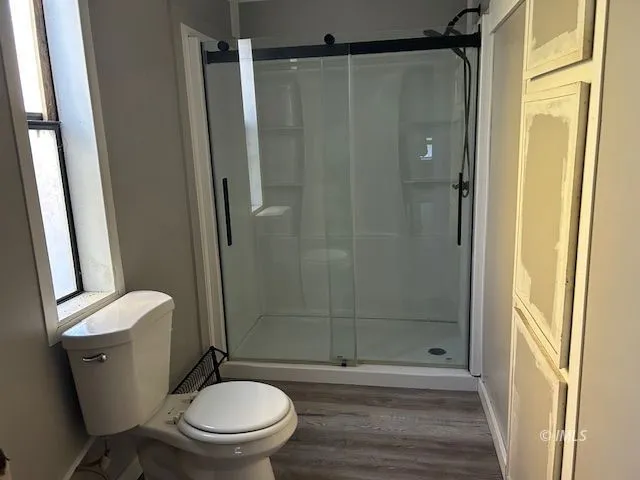 a view of an empty room and a window