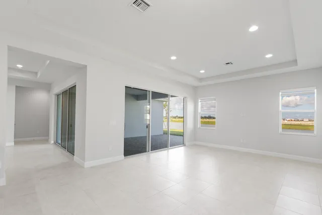 a bedroom with a large bed and a couch