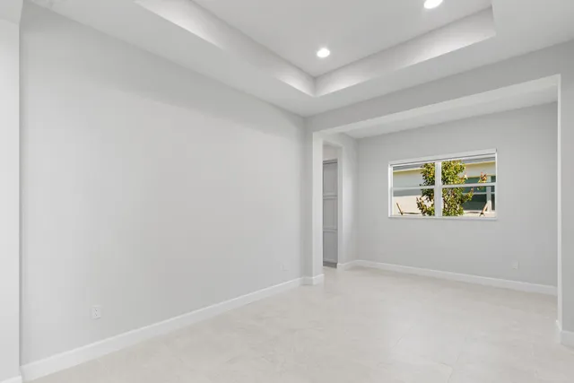 a bathroom with a shower and a glass door