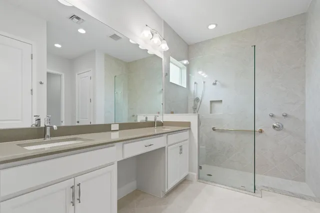 a bedroom with bed and a window