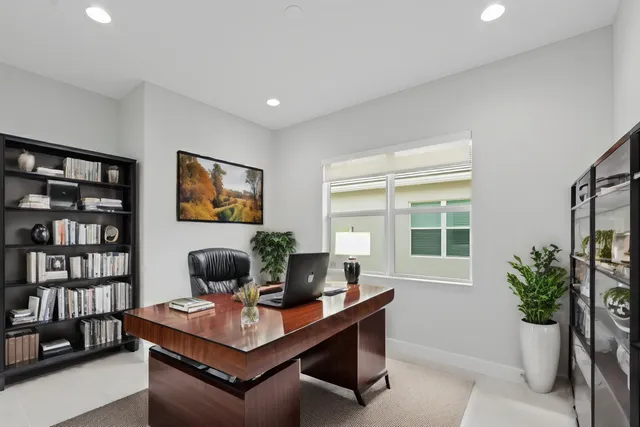 a view of a swimming pool with a lawn chairs and swimming pool