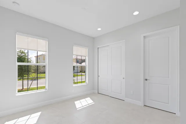 an aerial view of residential building with outdoor space and ocean view